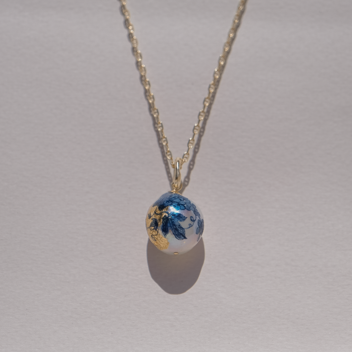 Gilded Painted Pearl on Anchor Chain