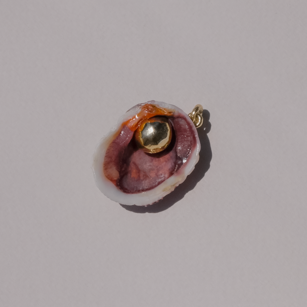 Orb In Shell On Lucet Silk Cord