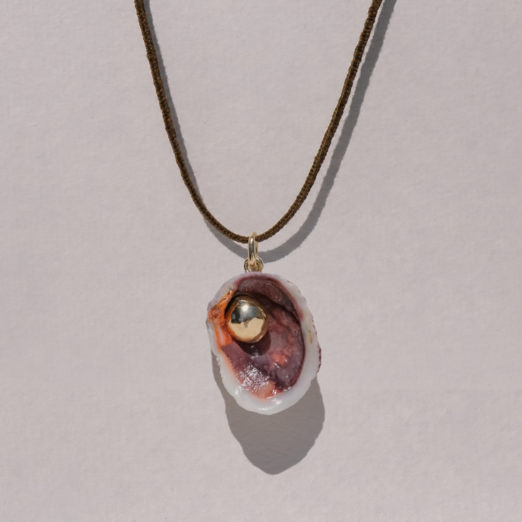 Orb In Shell On Lucet Silk Cord
